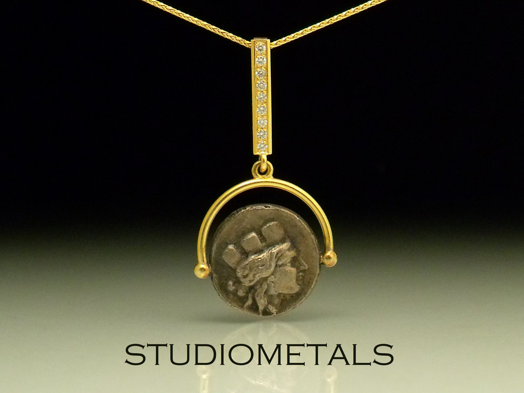silver roman coin pendant in 18k yellow gold with micropave diamonds