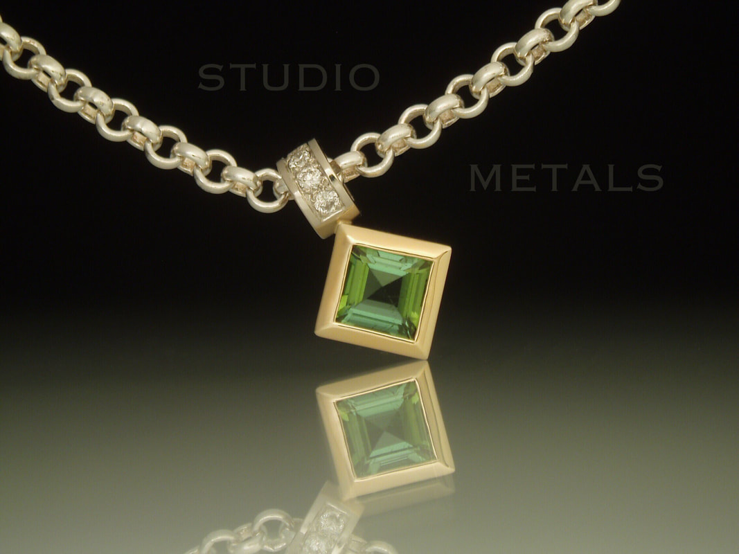 Square green tourmaline and diamond pendant in 14k gold