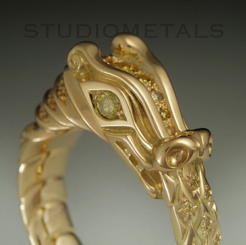 18k gold Viking dragon ring, hand carved in 18 karat gold and bead set with natural, facny yellow diamonds.