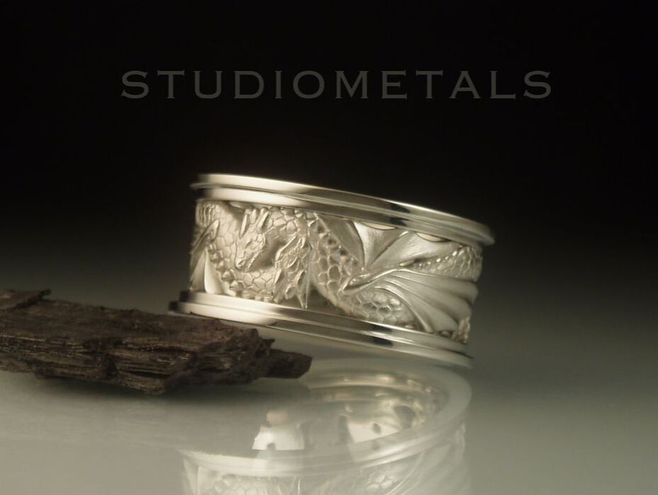 Wide, hand carved double dragon wedding band for men or women in solid 19k white gold.