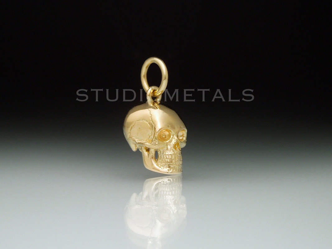 anatomically correct 10mm skull pendant in solid 14k gold