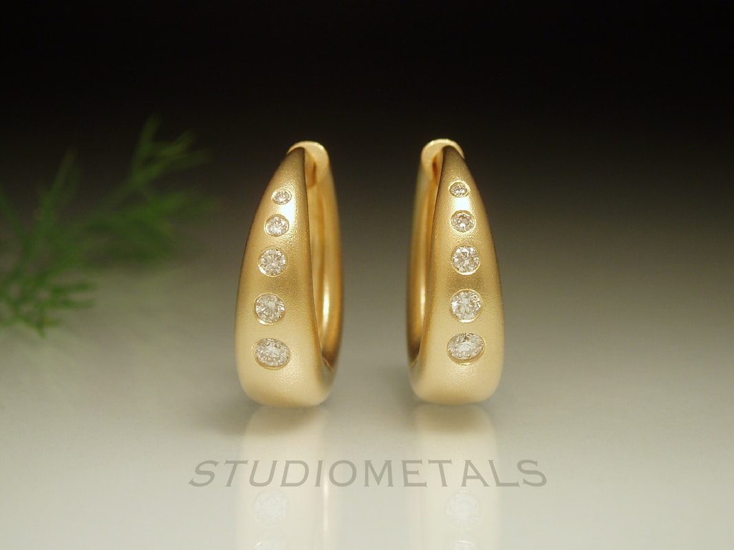 16mm matte 18k gold hoops with flush set diamonds