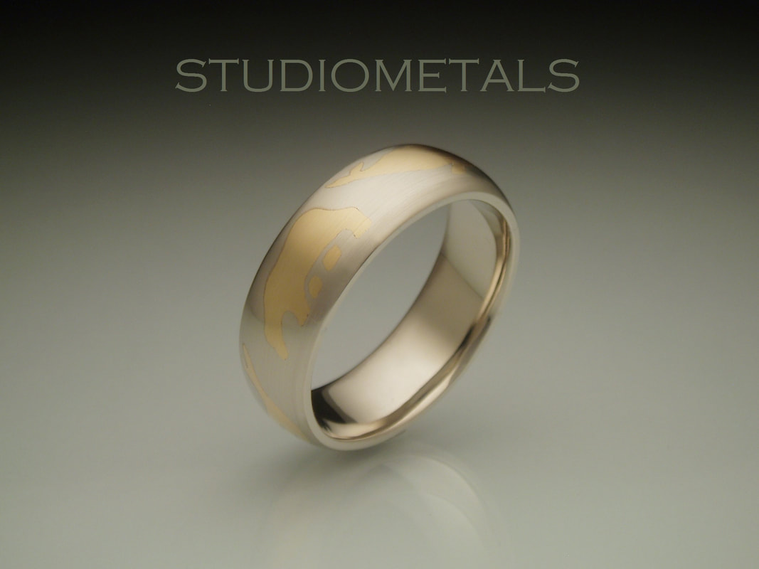 inlaid gold arctic animal men's wedding band 