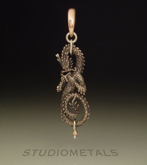 Intricate dragon pendant in 14k white and rose gold