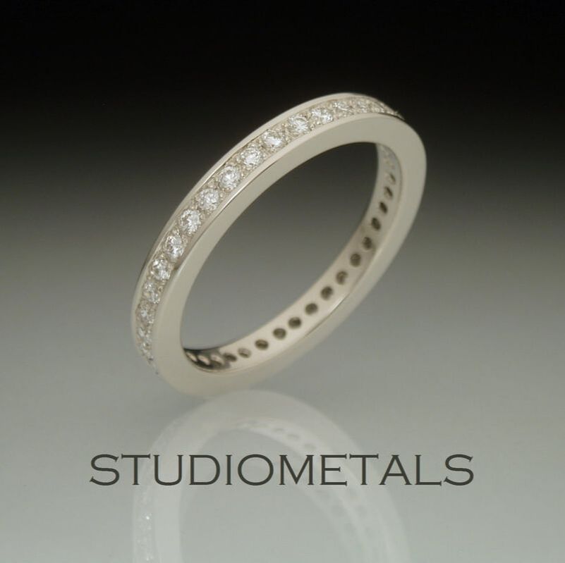 3mm, pave set, diamond eternity band in 14 karat white gold.