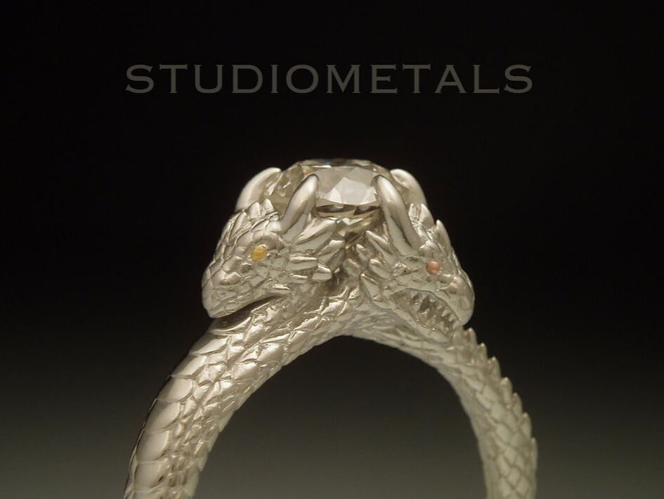 1.3 carat diamond set in three dragon engagement ring