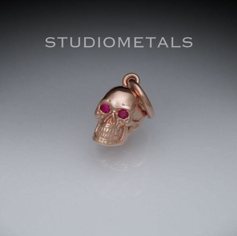 solid 14k rose gold skull charm with real ruby eyes