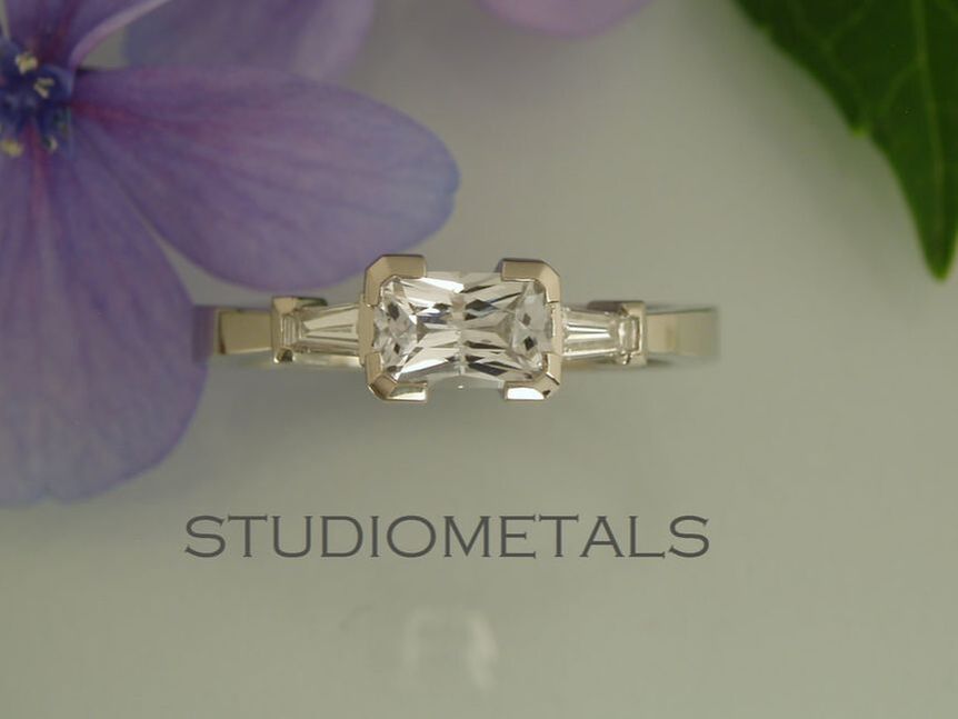 radiant cut white sapphire ring with tapered diamond baguettes