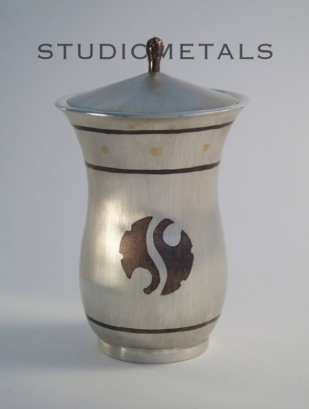 Handmade sterling silver vessel with shakudo and 18k gold inlay.