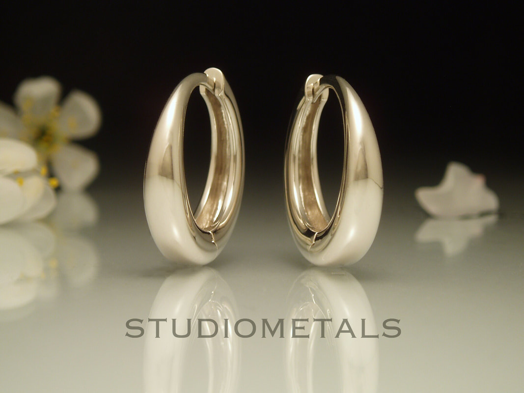 medium 18mm hoops in 14k