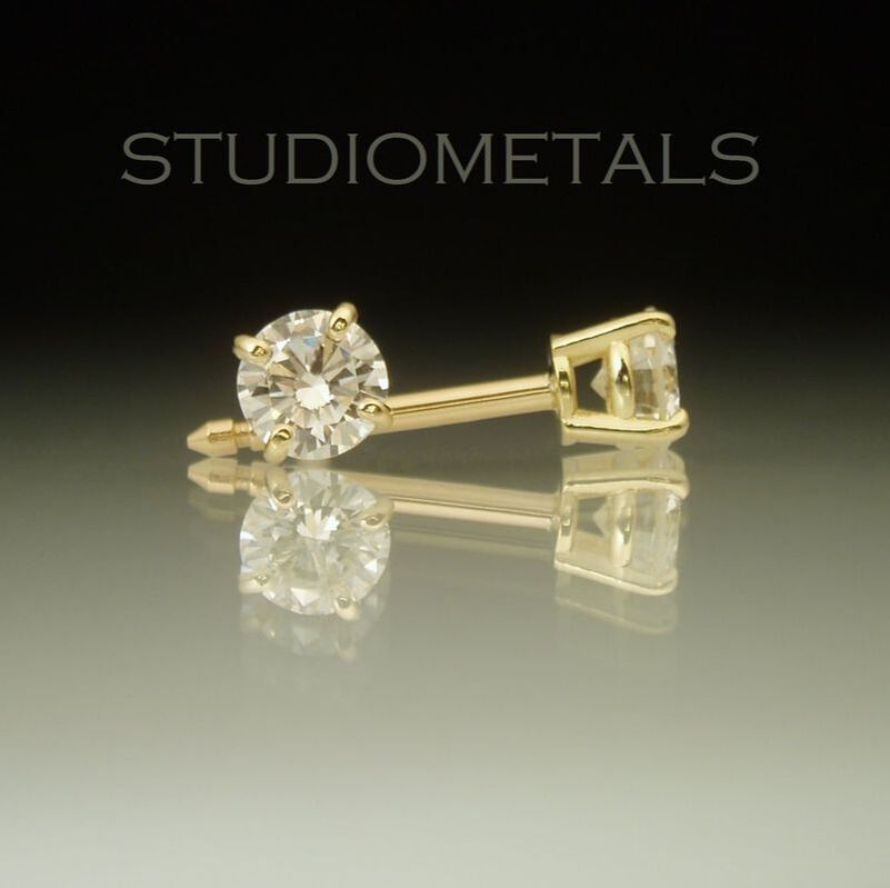 4mm. classic 0.6 carat diamond stud earrings in 18k yellow gold.