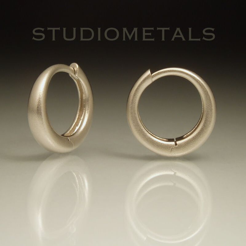 16mm diameter white gold hinged hoops.