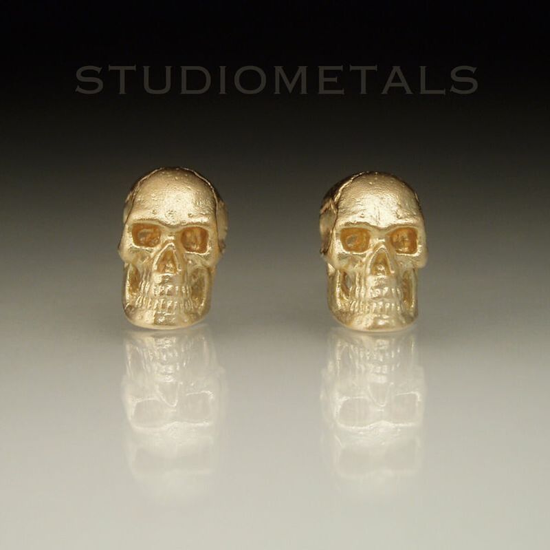 realistic skull earrings in solid 14k yellow gold