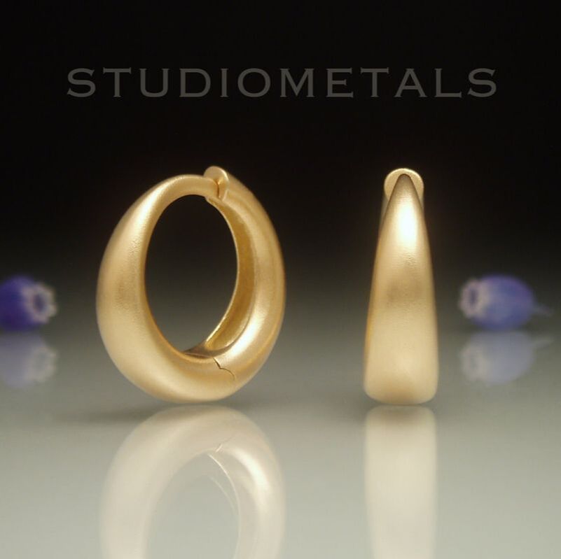 Matte, 18k yellow 16mm diameter hoop earrings with hinges.