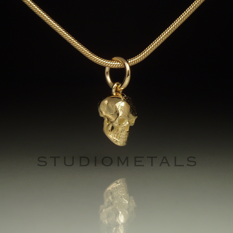anatomically correct skull charm in solid 14k yellow gold