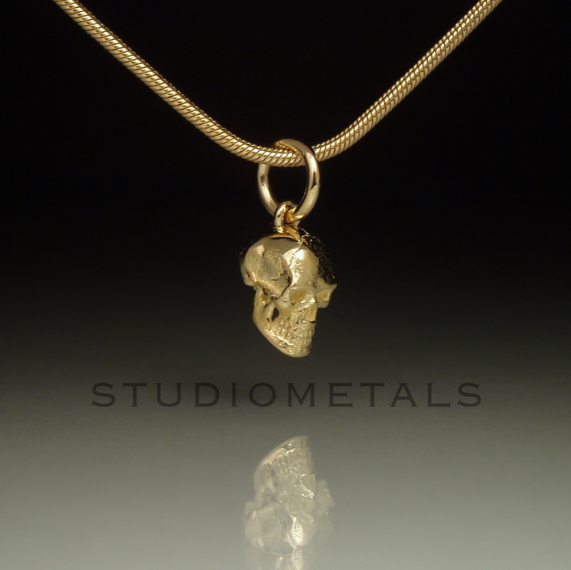 14 karat solid gold realistic, 8mm skull charm pendant. 