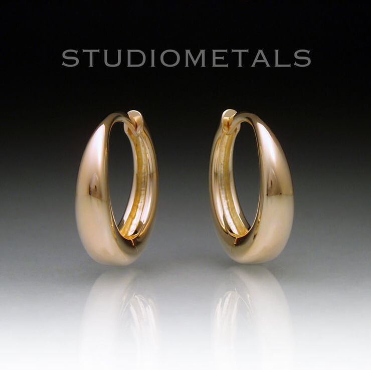 Tapered, 16mm by 4mm, chunky bold 14k gold hinged hoop earrings for men or women.