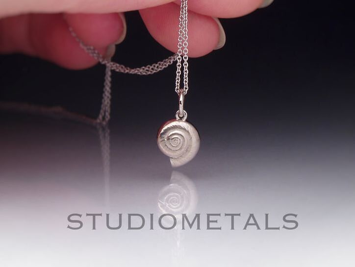 Solid 14k or 18k spiral snail shell pendant on an 18 inch, 1mm rolo chain.