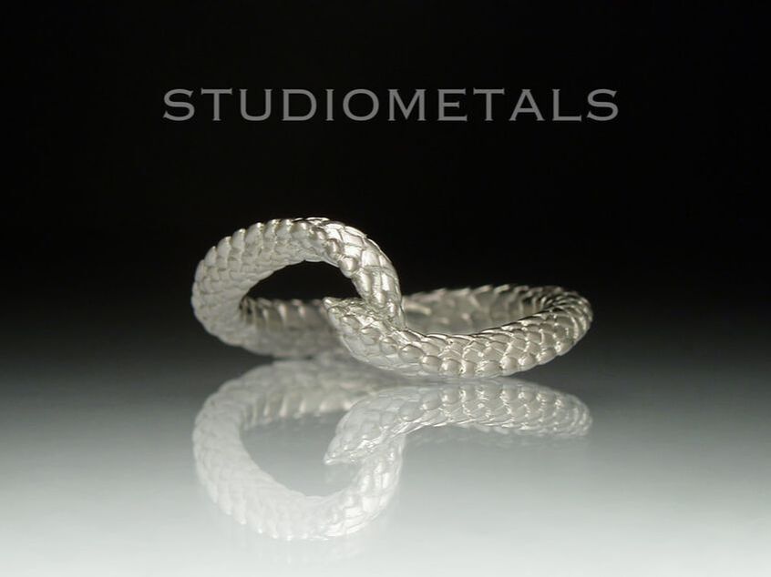 Hand carved double sperpent dragon tail ring for women in solid, 18k white gold.