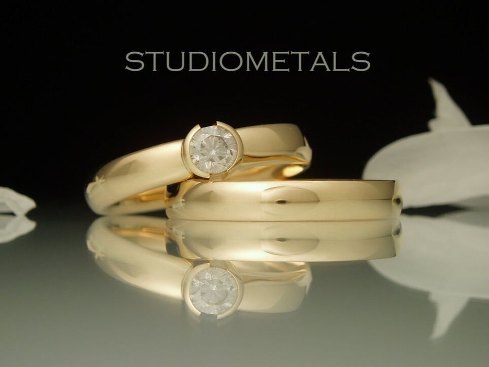 yellow gold half bezel diamond engagement ring and wedding band