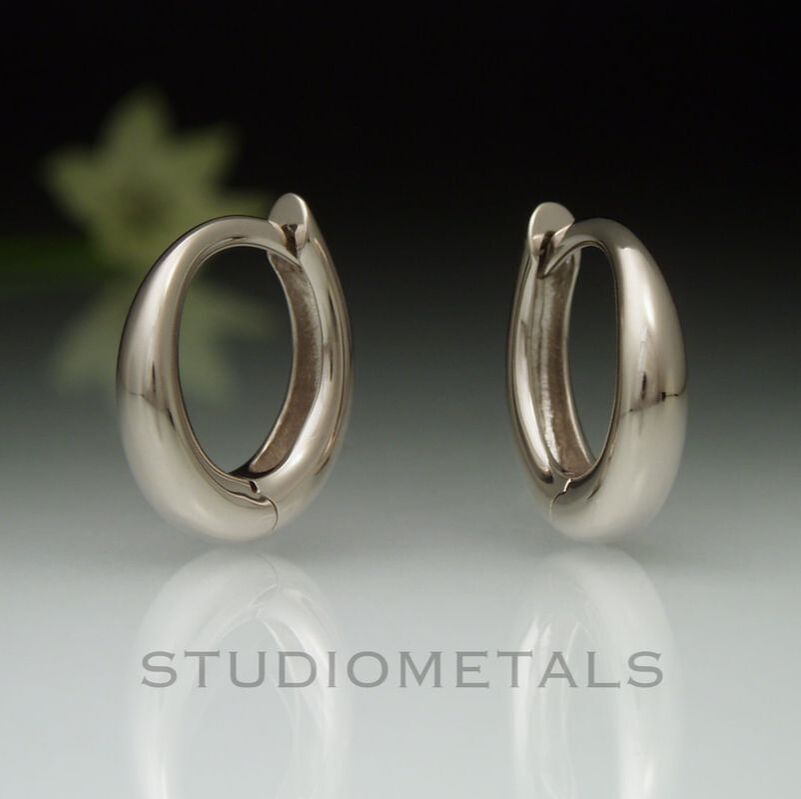 Solid, unplated, nickel free white gold, 13mm tapered oval huggie hoop earrings.