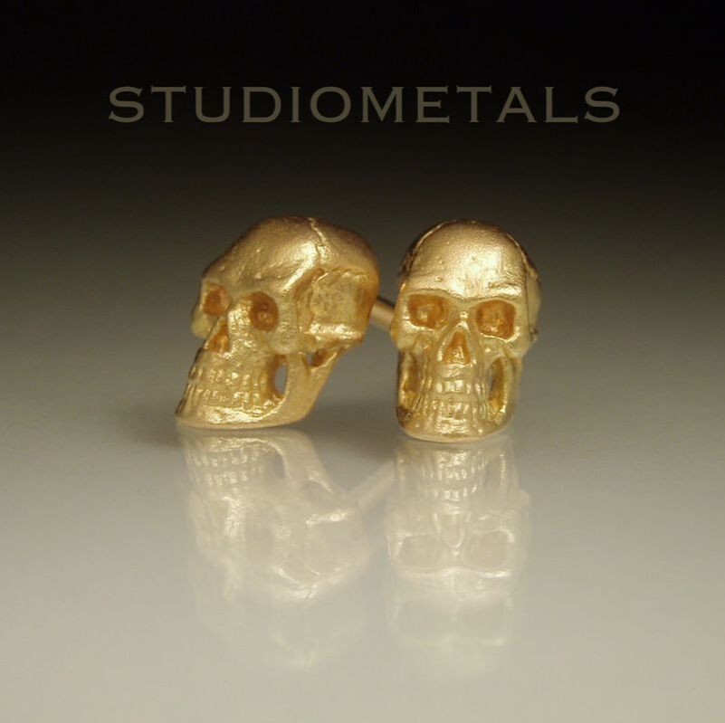 18k yellow gold, realitic human skull stud earrings.
