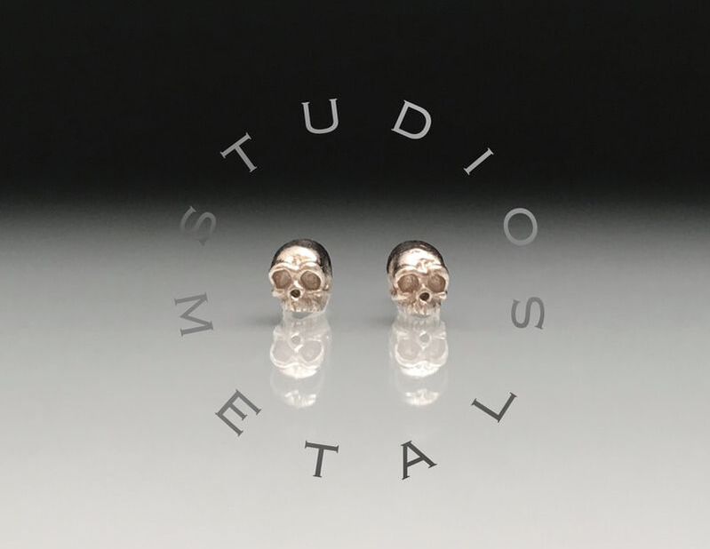 solid 14k gold tiny skull earrings