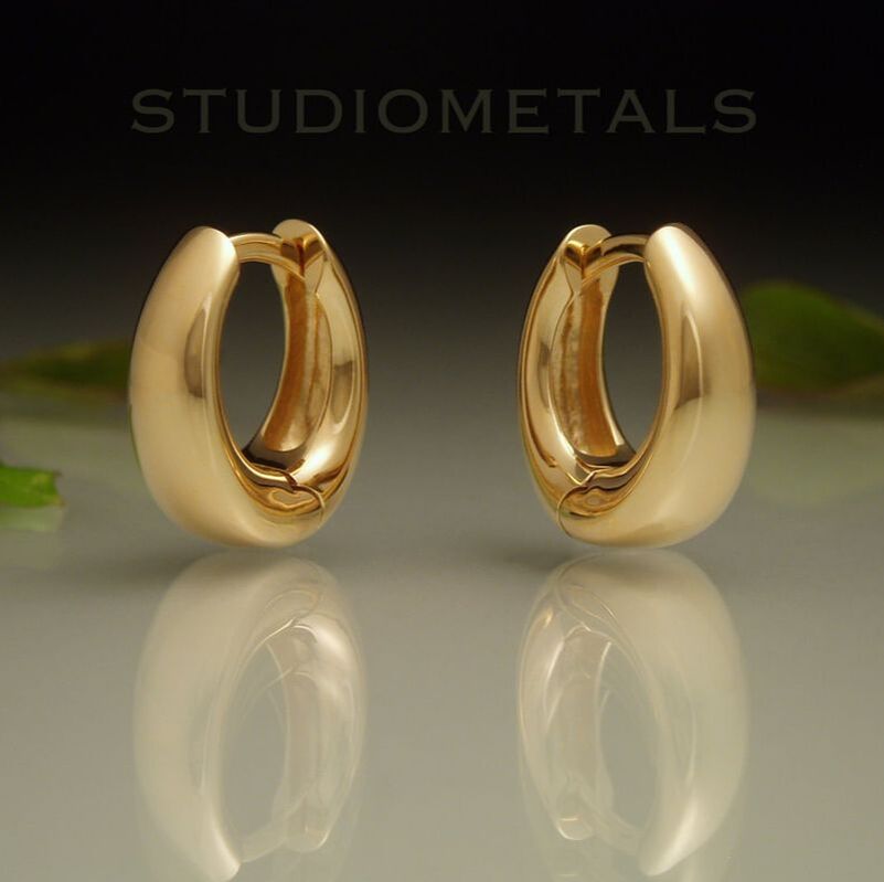 wide tapered oval huggie hoop earrings in solid 18k yellow gold